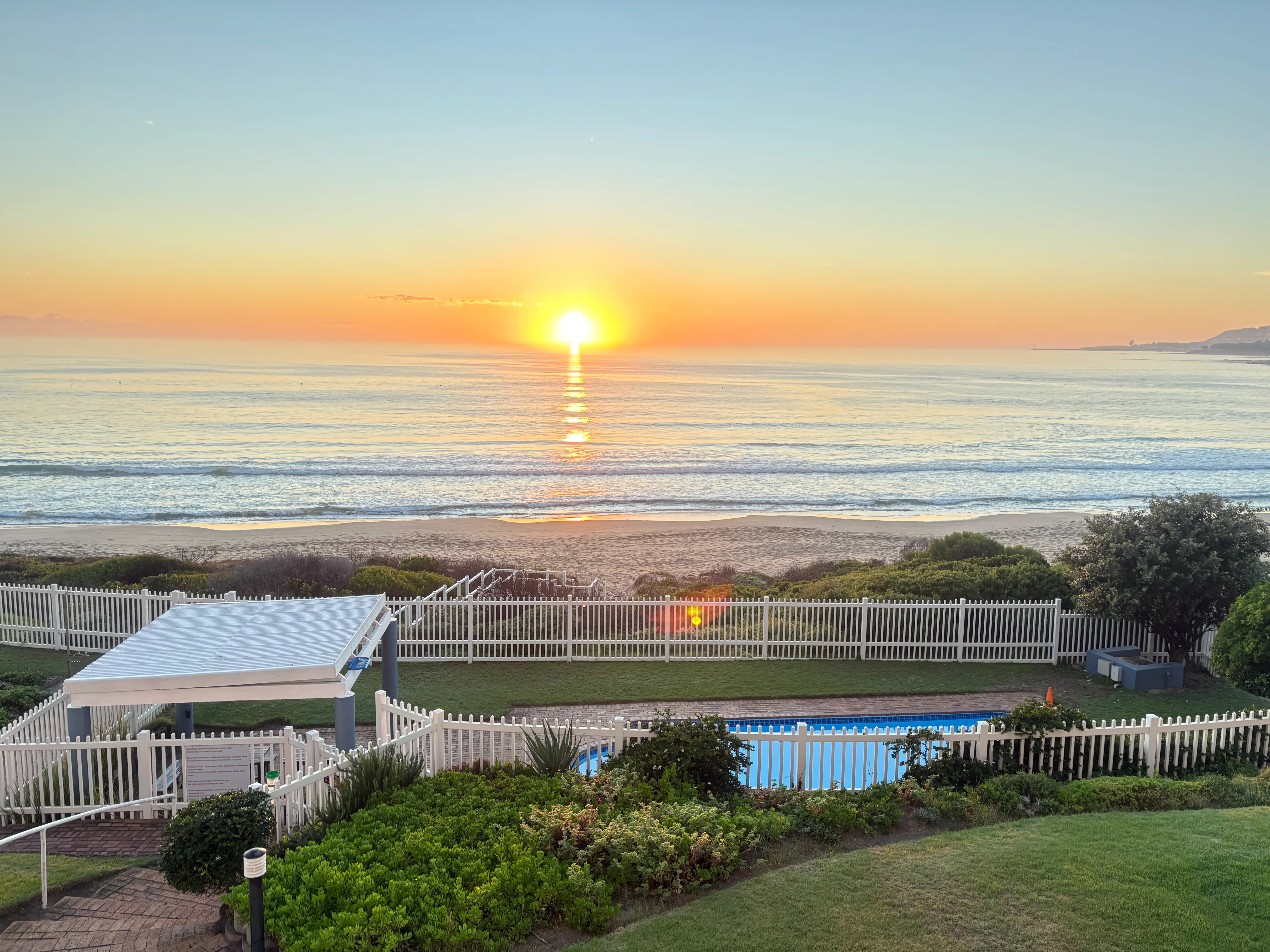 Balcony view with swimming pool overlooking Diaz Beach