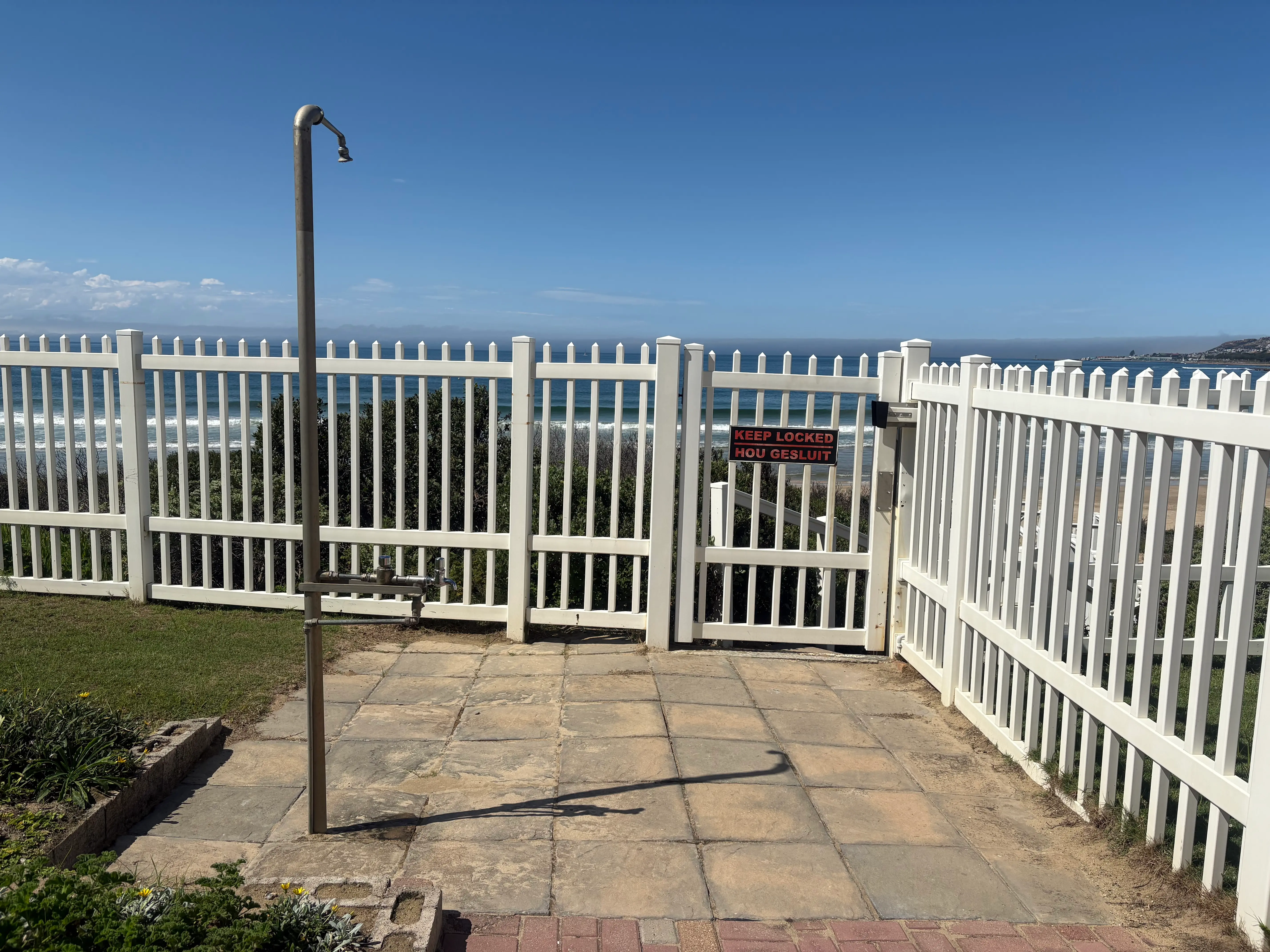 Outside shower and gate to beach